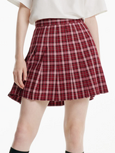 a lady in red checked pleated mini skirt